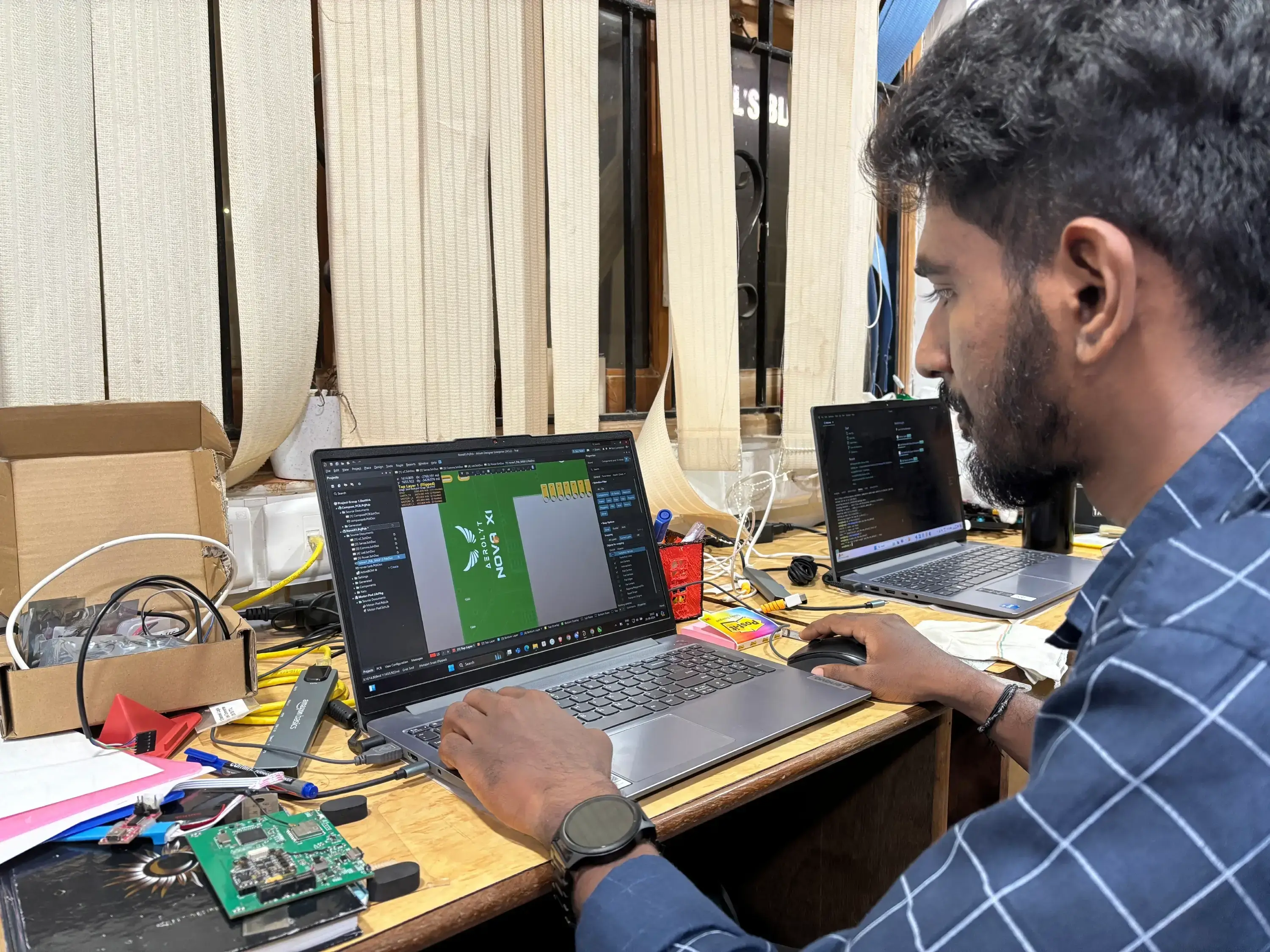 A team member focused on programming a drone light show using advanced drone software, showcasing the innovative drone technology and design for an impressive drone light show. The team member ensures precise flight paths and synchronized lighting for the upcoming drone show. A key moment in the operation of a drone manufacturer specializing in drone light shows.
